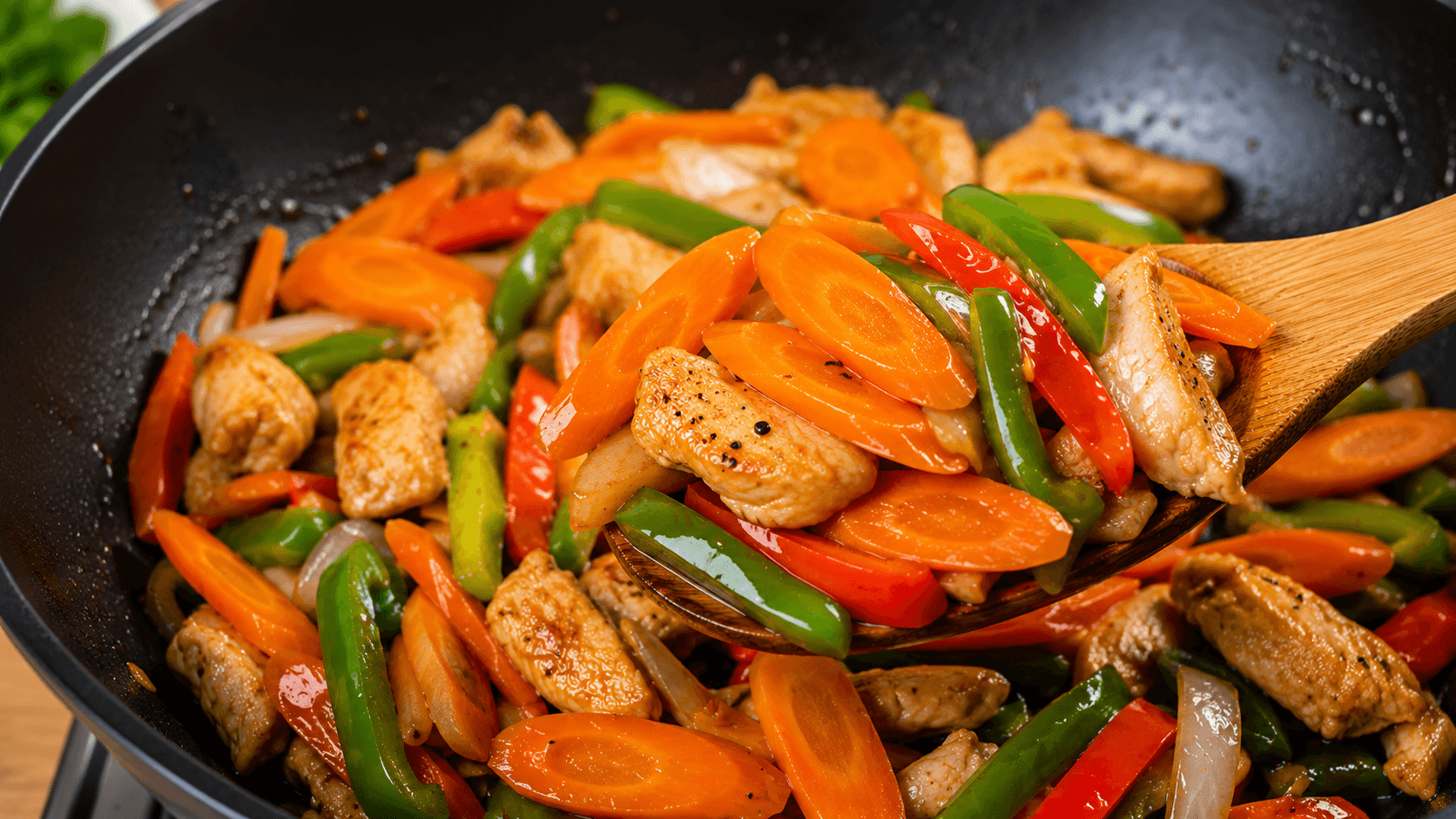 Perfect crisp-tender carrots ready to serve in a homemade chicken stir fry
