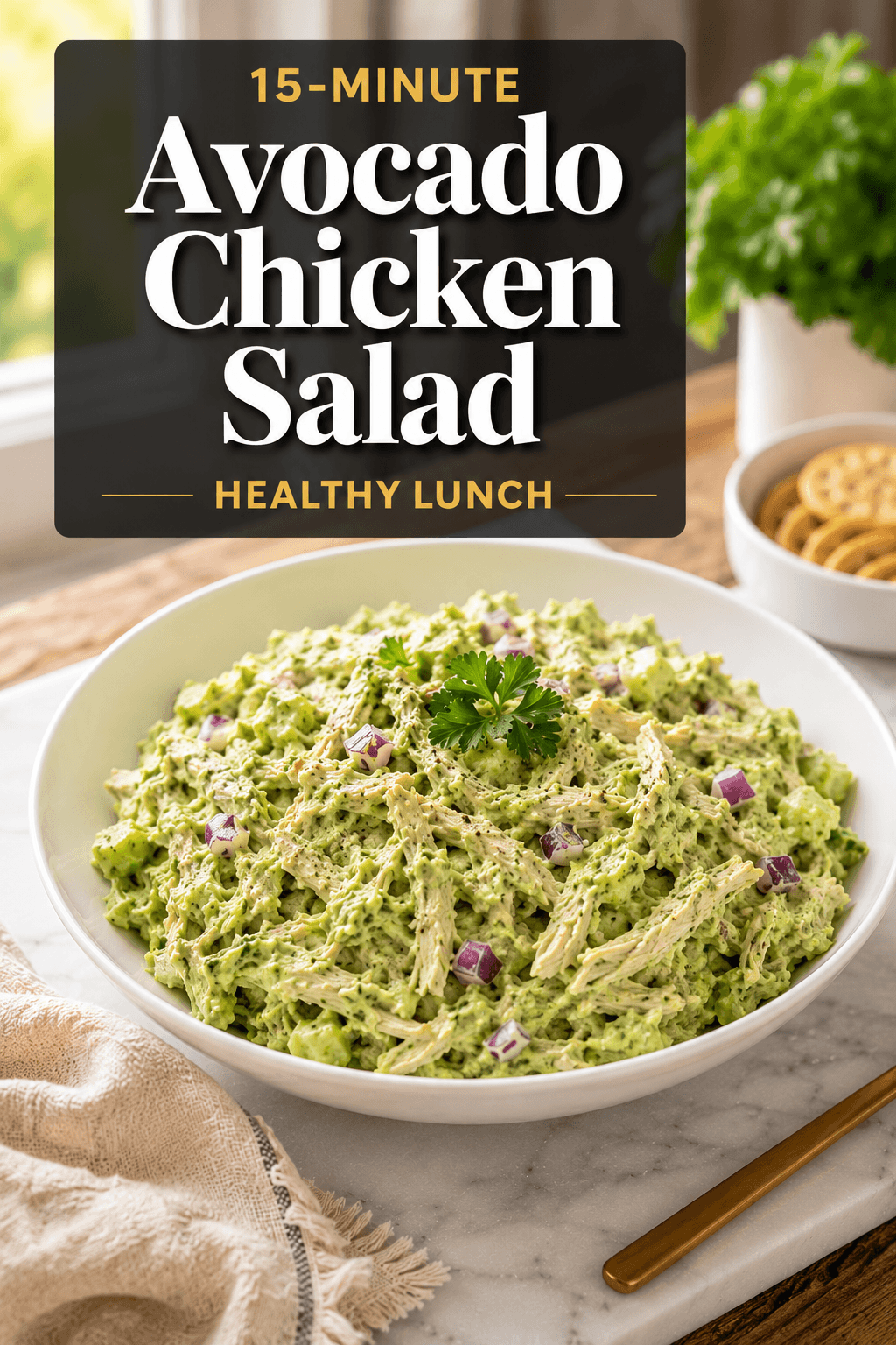 15-Minute Avocado Chicken Salad healthy lunch recipe served on a white plate with creamy avocado dressing, shredded chicken, red onion, and celery in a bright modern kitchen setting
